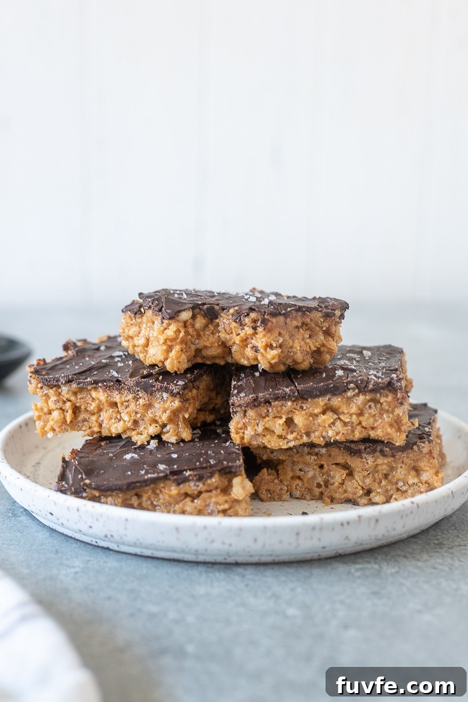 No-Bake Peanut Butter Rice Krispie Treats Recipe 6 Peanut butter rice krispie bars with bite out of top bar