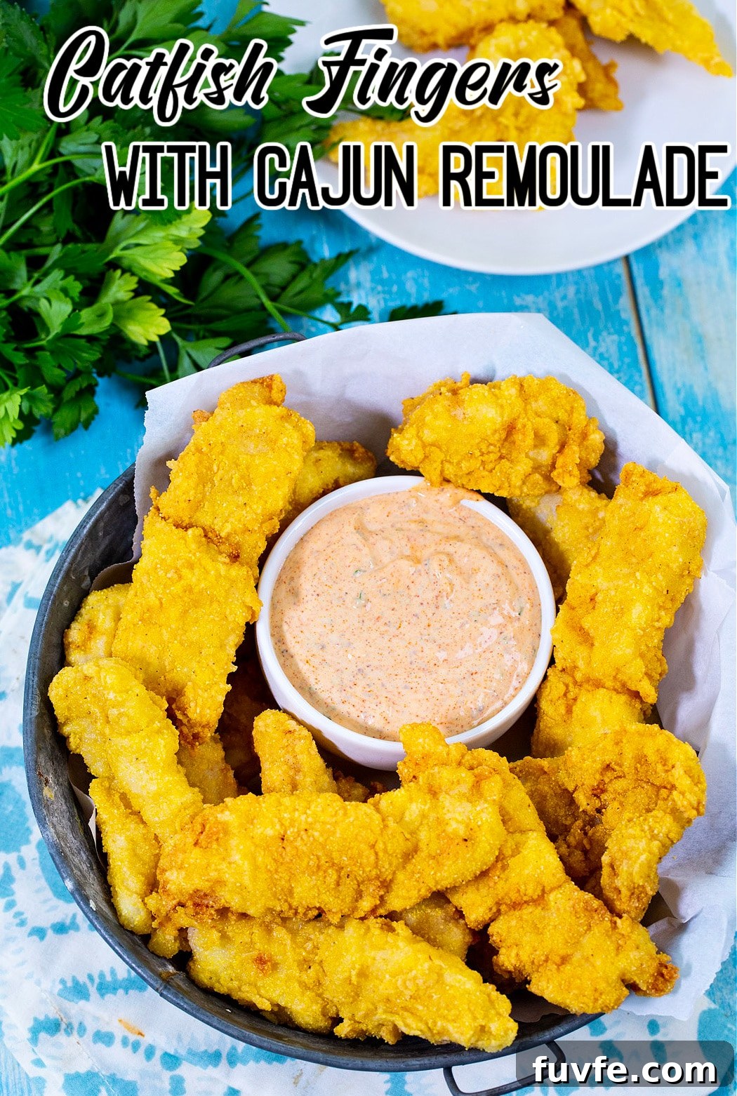 Fried Catfish Fingers in a basket with remoulade.