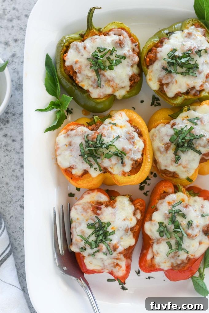 Italian stuffed peppers on a white serving platter