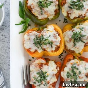 How to Make Classic Italian Stuffed Peppers 9 Italian stuffed peppers on a white serving platter