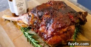 Slow Cooked Leg of Lamb coated in real chutney with a jar of the cherry tree real chutney on the side