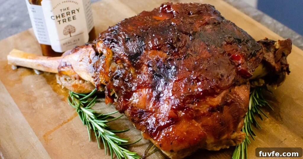 Slow Cooked Leg of Lamb coated in real chutney with a jar of the cherry tree real chutney on the side