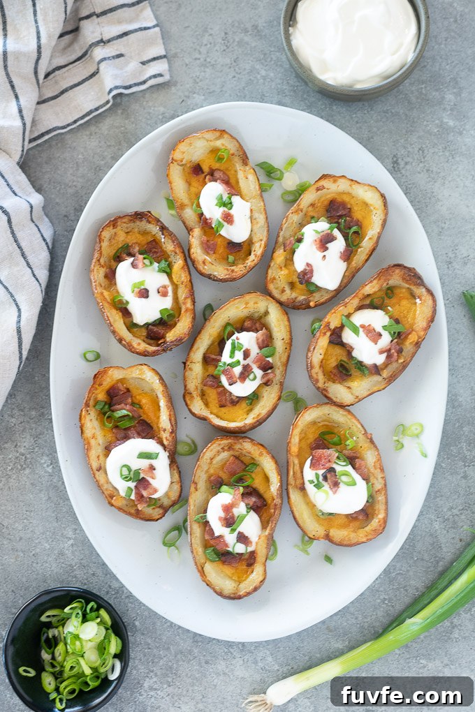 Platter of loaded potato skins garnished with scallions