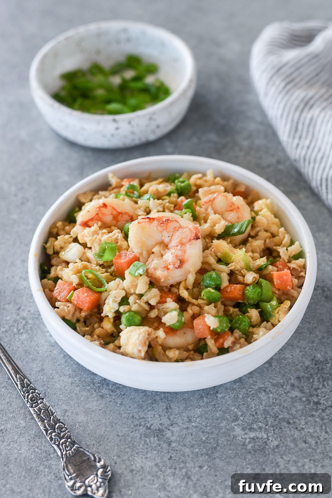 Authentic Shrimp Fried Rice Recipe with Garlic and Scallions 7 Shrimp fried rice in a bowl
