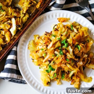 roasted cabbage with parsley garnish sprinkled on top.