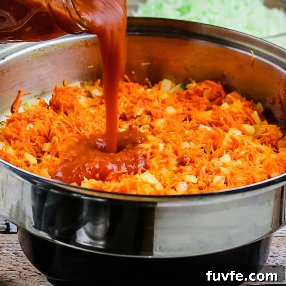 Quick No-Fuss Cabbage Roll Skillet for Busy Weeknights 7 Sauteeing carrots and tomato sauce with onions