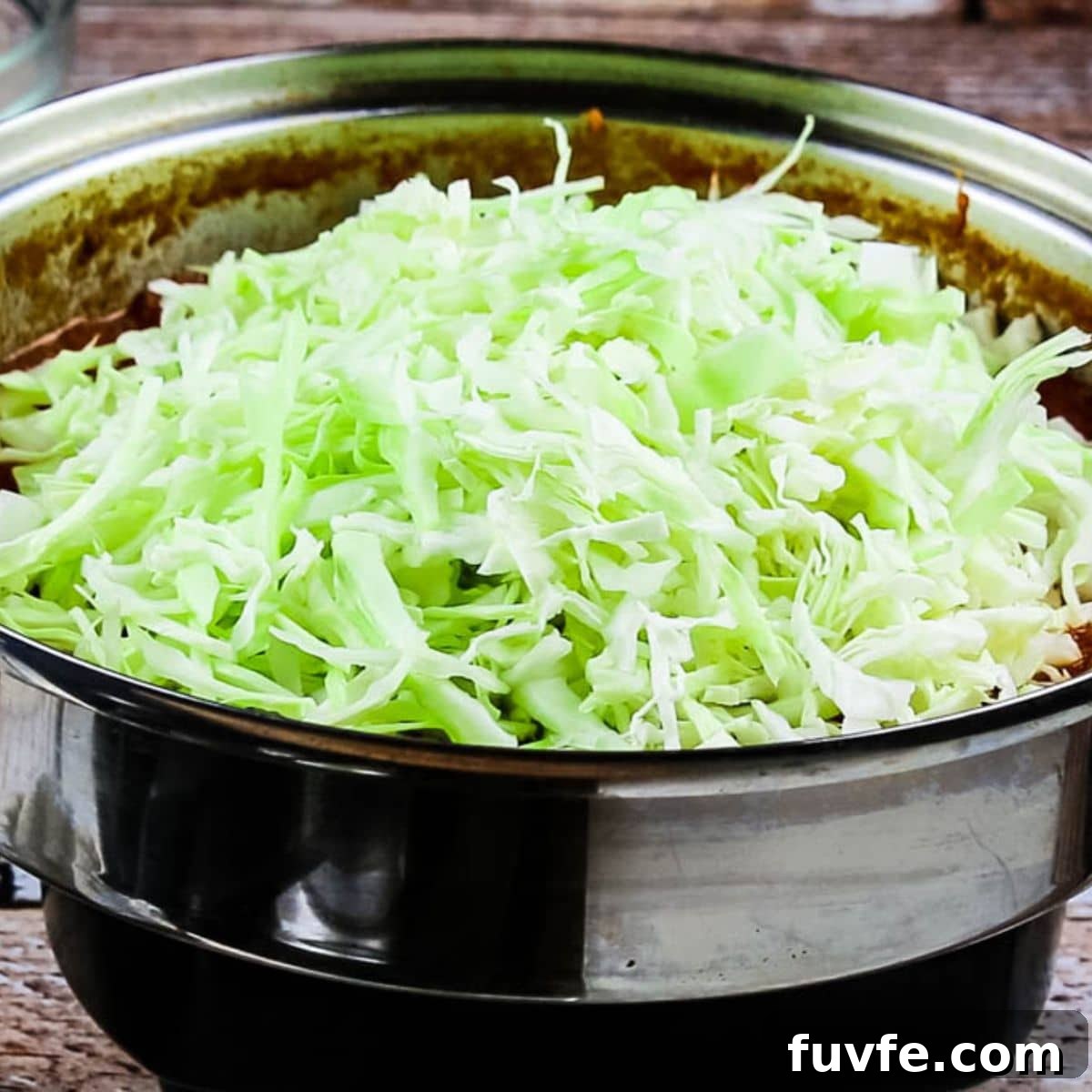 Quick No-Fuss Cabbage Roll Skillet for Busy Weeknights 8 Adding cabbage to vegetable sauce