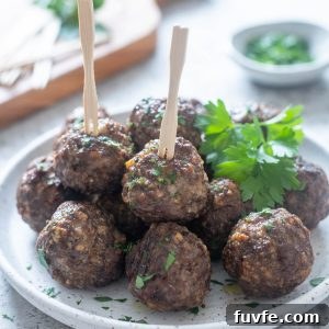 Crispy Air Fryer Meatballs Recipe 7 Air fryer meatballs on a plate with parsley