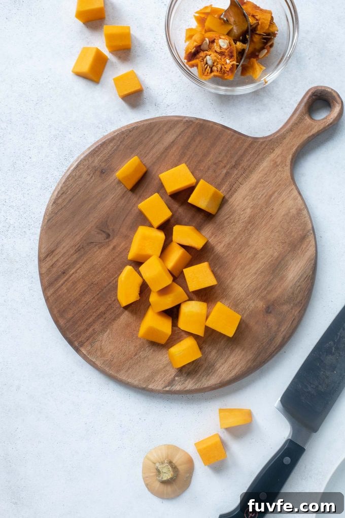How to Peel, Trim and Cube Butternut Squash for Recipes 2 Cubed butternut squash on a cutting board