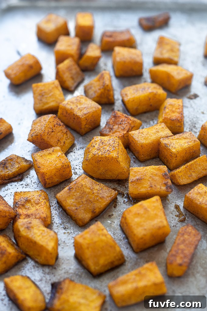Roasted butternut squash on a baking sheet