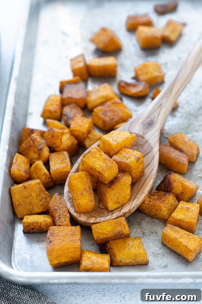 Oven roasted butternut squash in a wooden spoon
