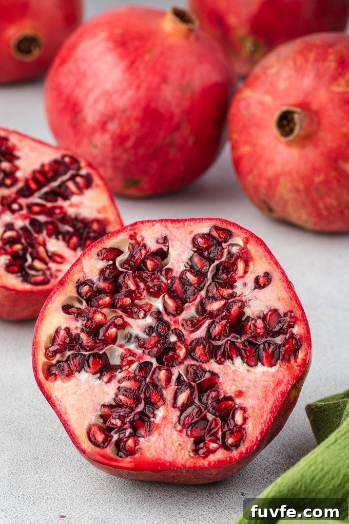 How to Cut and Remove Pomegranate Seeds 3 Halved pomegranate in how to cut a pomegranate open tutorial