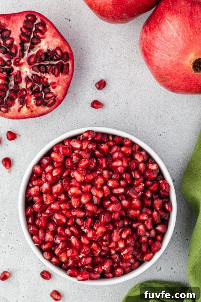 How to Cut and Remove Pomegranate Seeds 7 Pomegranate arils in a white bowl