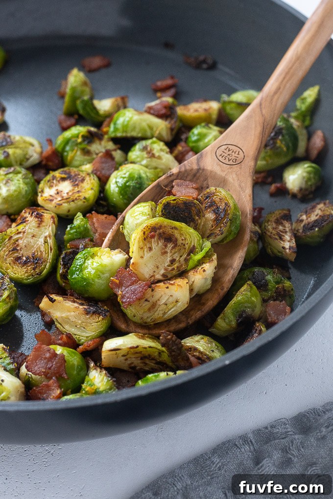 Crispy Roasted Brussels Sprouts with Bacon 6 Brussels sprouts with bacon in a skillet