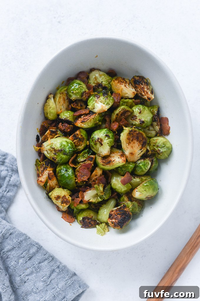Crispy Roasted Brussels Sprouts with Bacon 7 Pan fried brussels sprouts with bacon in a bowl