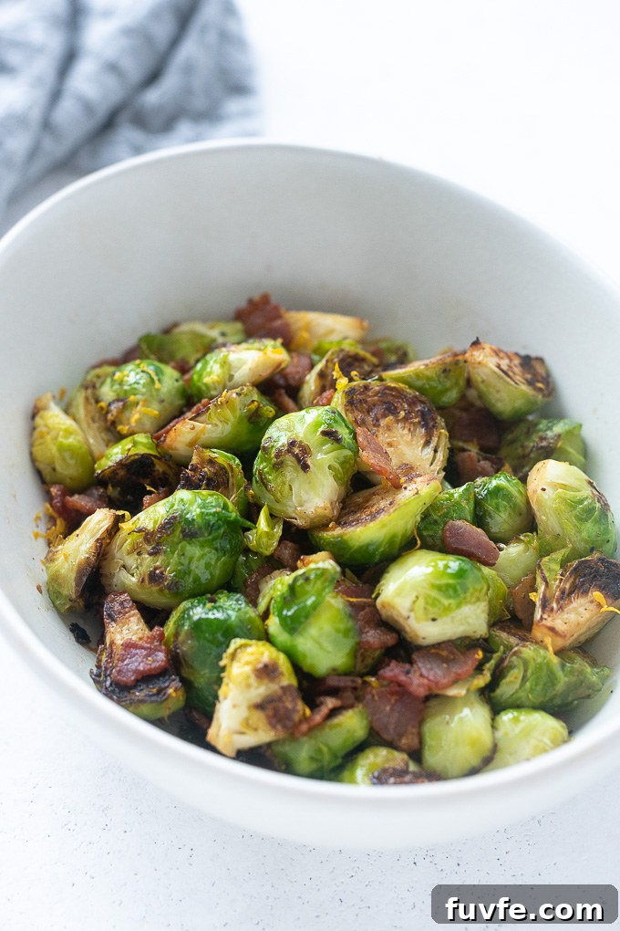 Crispy Roasted Brussels Sprouts with Bacon 8 Brussels sprouts with bacon in a white serving bowl