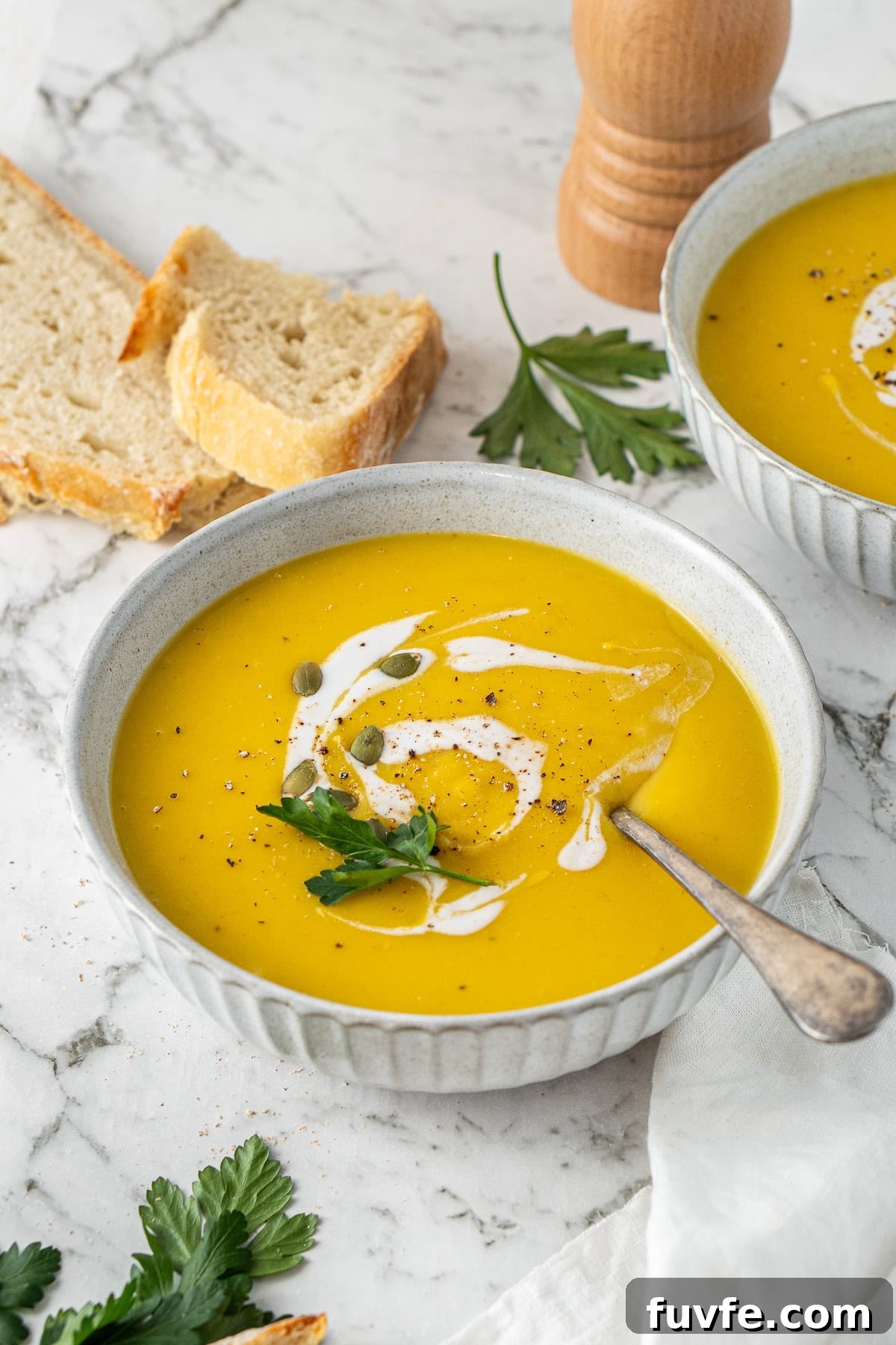 Grandma’s Creamy Pumpkin Soup Recipe 4 The pumpkin soup served into bowls.