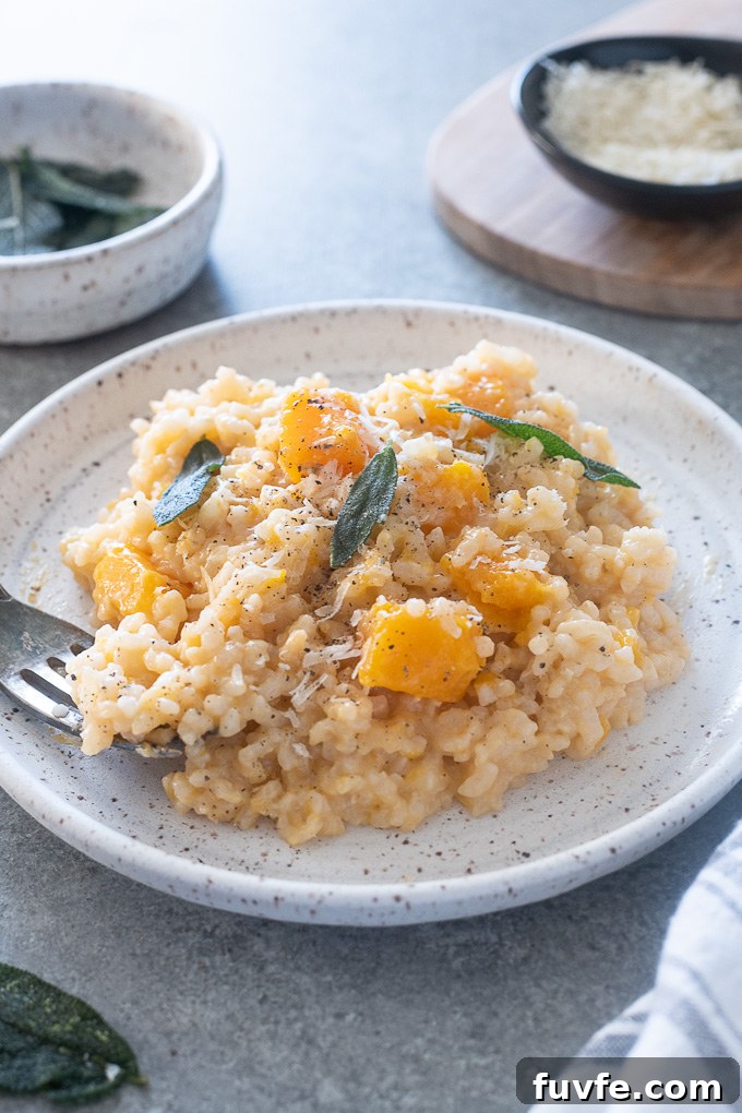 Plate of butternut squash risotto with crispy sage leaves on top