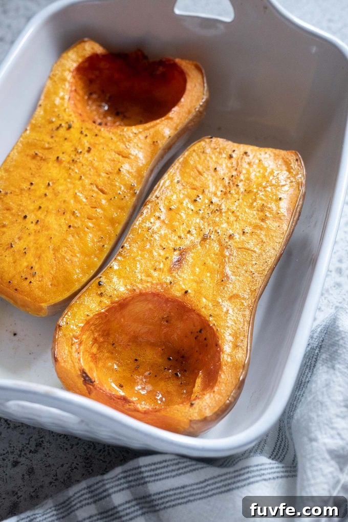 Roasted whole butternut squash in a baking dish