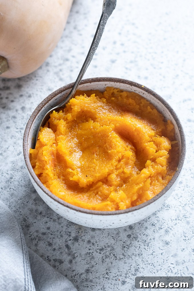Roasted whole butternut squash flesh in a bowl