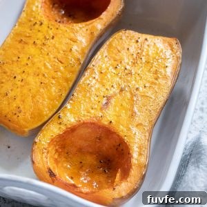 Roasted whole butternut squash in a baking dish