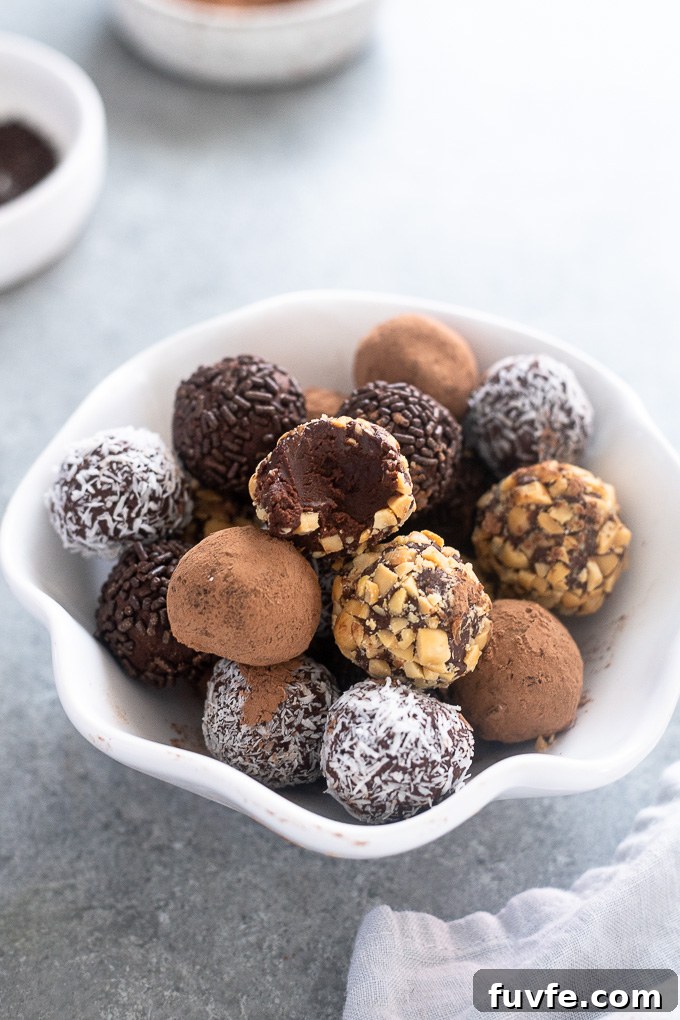 Dark chocolate truffles with bite out of top truffle