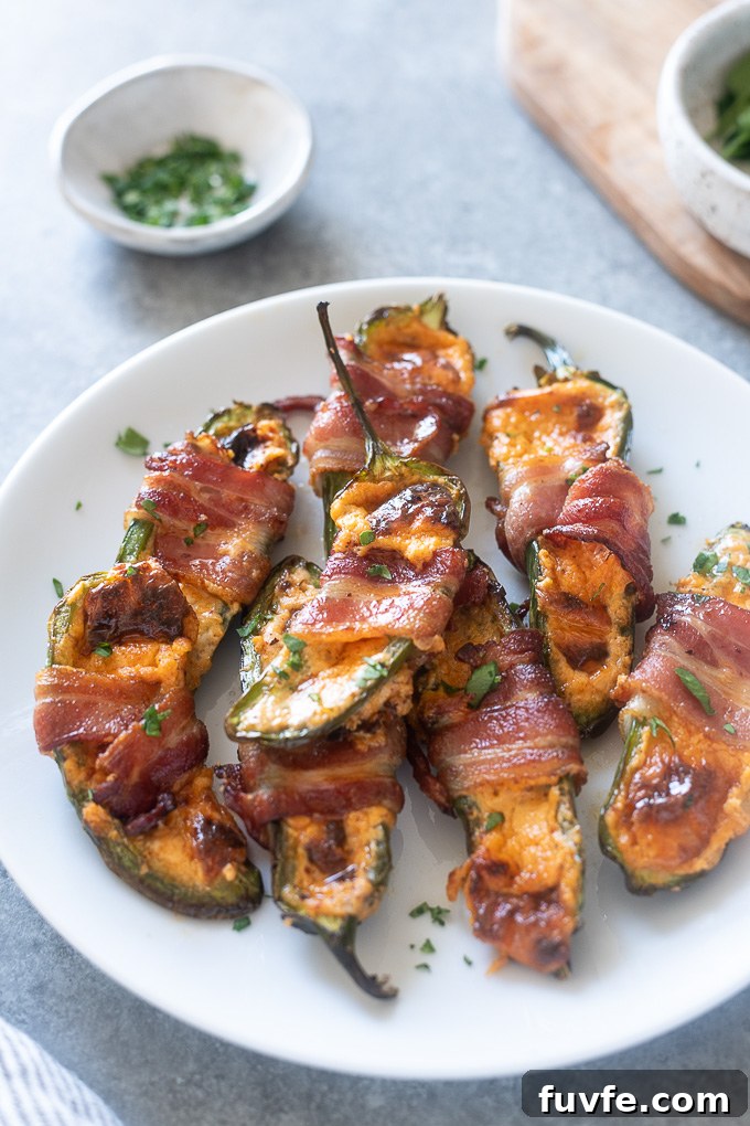 Crispy Air Fryer Jalapeño Poppers Recipe 7 Plate of air fryer jalapeno poppers wrapped in bacon