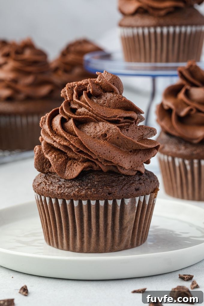 Chocolate Ganache Recipe for Glossy Glaze and Filling 8 Whipped chocolate ganache frosting piped on a cupcake