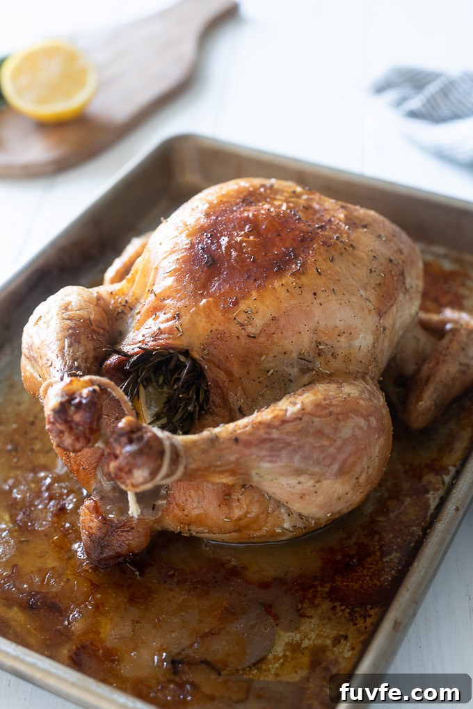 Roasted Lemon-Garlic Chicken with Crispy Skin 6 Whole roasted chicken trussed on a baking sheet