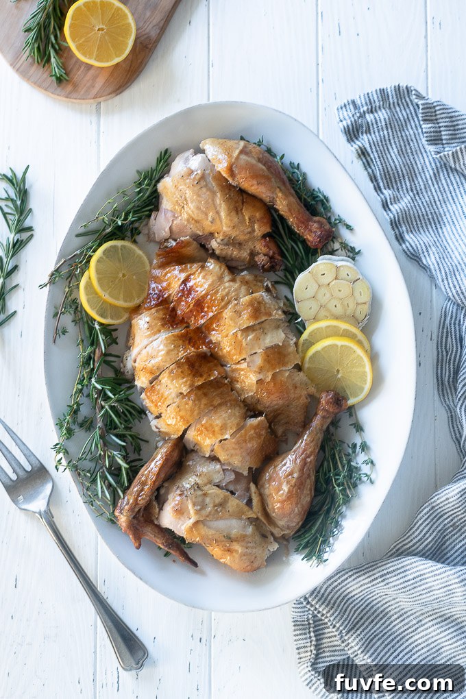 Roasted Lemon-Garlic Chicken with Crispy Skin 8 Roast chicken carved on a platter