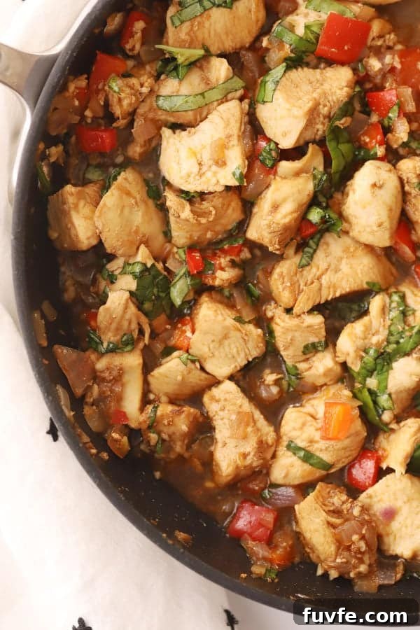 Garlic Basil Chicken Stir-Fry with Crispy Vegetables 2 thai basil chicken stir fry in a pan, a delicious stir fry chicken with basil that tastes like it came from your favorite thai restaurant.