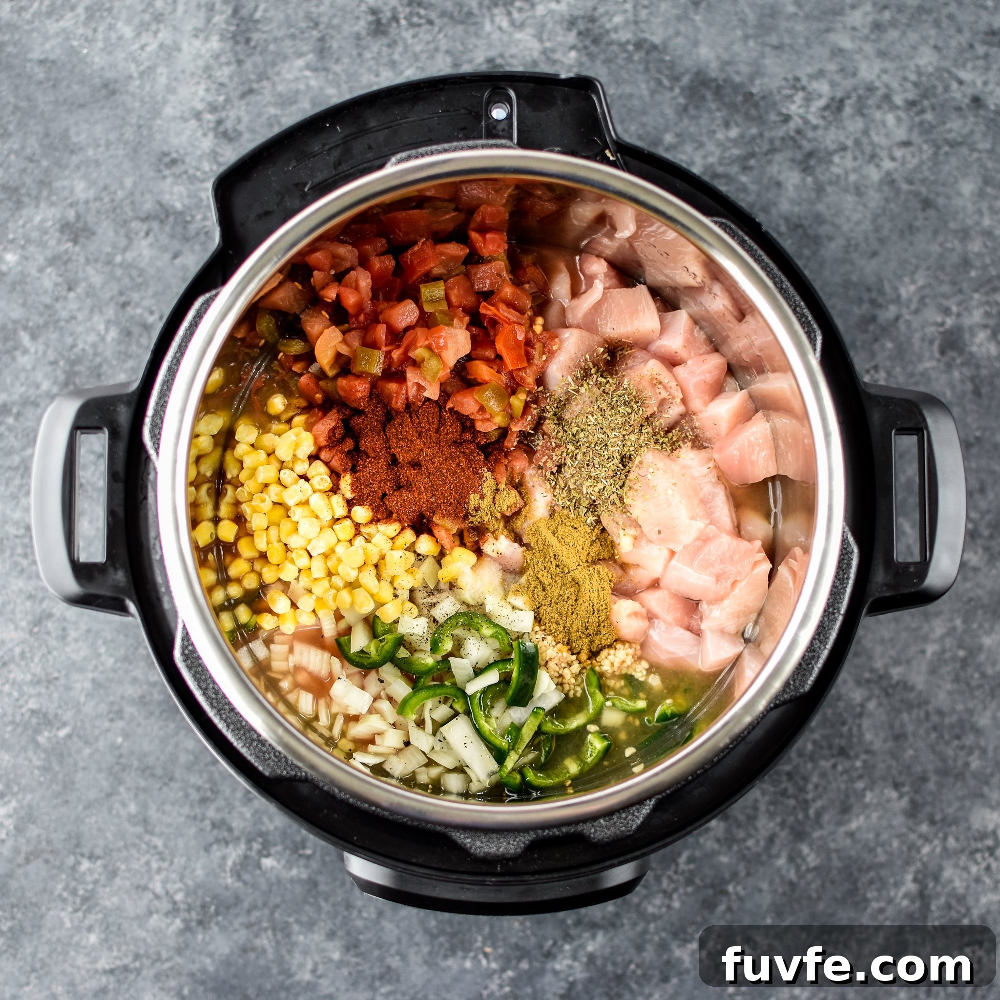Instant Pot Jalapeño Popper Chicken Soup Recipe 3 A view of the ingredients for the Instant Pot Jalapeno Popper chicken Soup inside the Instant Pot from above.