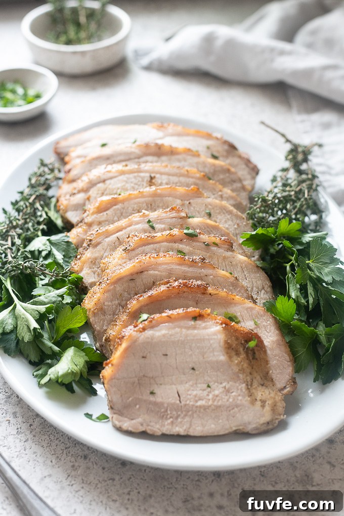 Roasted Pork Loin with Garlic and Rosemary 7 Pork loin roast sliced on a serving platter