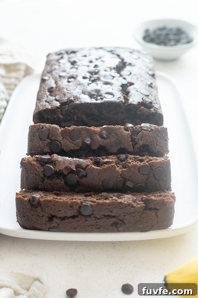 Healthy chocolate banana bread sliced on a platter