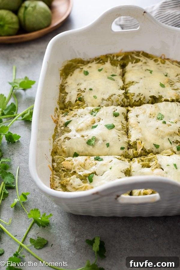 chicken verde enchilada casserole cut into squares in baking dish