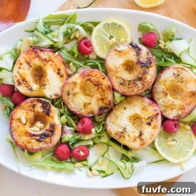 Grilled Serano Honey Peaches on a bed of zucchini and raspberries.