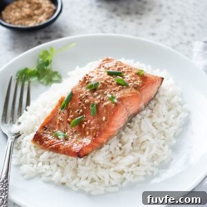 Miso-Glazed Salmon Recipe with Sesame and Scallions 6 Miso salmon over rice on a plate