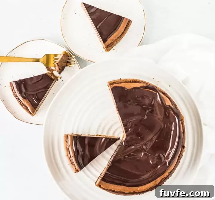 overhead photo of sliced amaretto cheesecake with two slices on plates