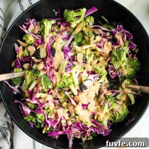 Chunks of raw broccoli and cabbage with a miso dressing, topped with scallions, almonds and dried cherries.
