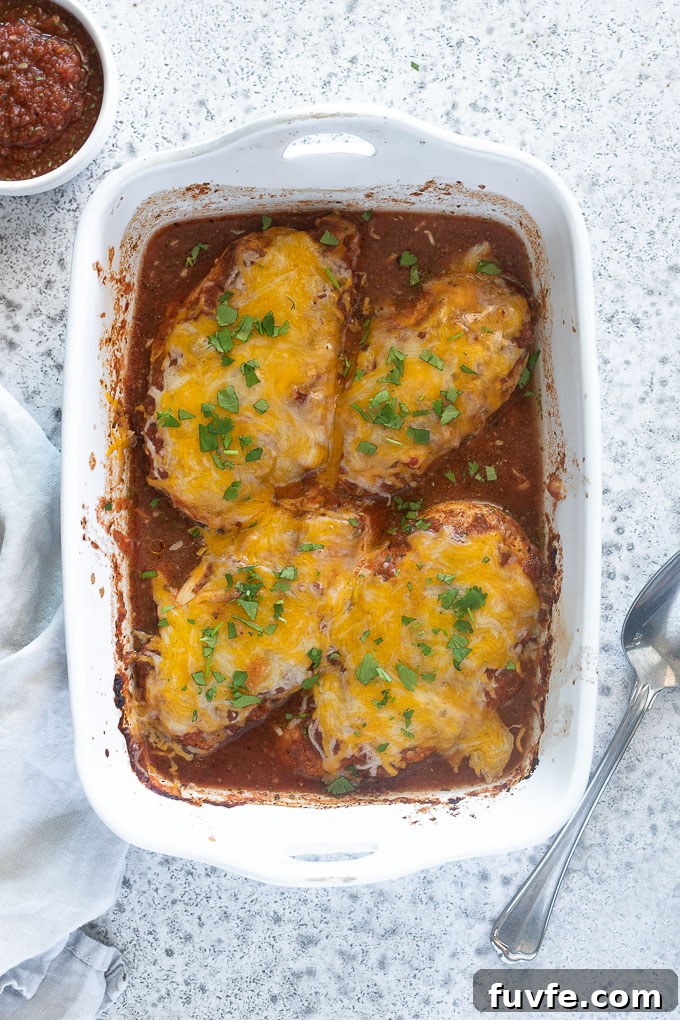 baked salsa chicken in a baking dish