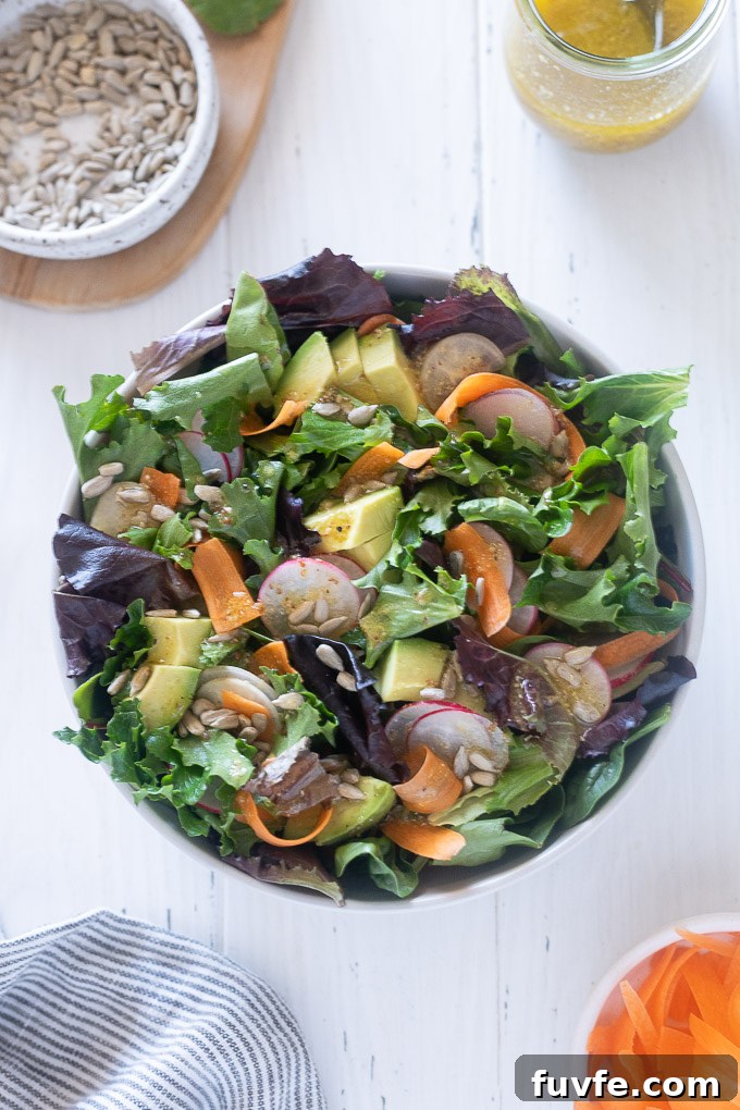 Spring Mix Salad Recipe: Fresh Greens with Lemon Vinaigrette 3 Spring mix salad in a white bowl
