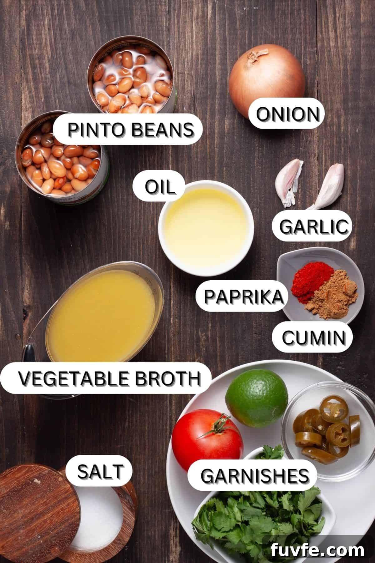 Ingredients for vegan refried beans on a dark table.