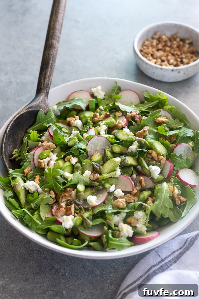 Cold asparagus salad in a bowl with lemon vinaigrette