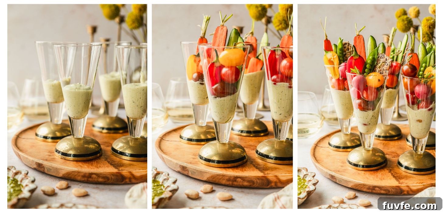 Crudité Cups with Fresh Pesto Dip for Entertaining 5 Three steps to making crudités cups. In photo 1, glasses of pesto dip is on a wood board next to yellow flowers and glasses of white wine on a tan counter. In photo 2, the cups have carrots, cucumbers, cherry tomatoes, and peppers. In photo 3, the cups have radishes, crackers, and snap peas.