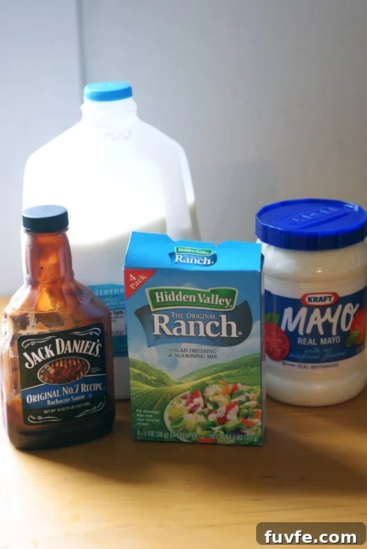 Milk, ranch, BBQ and Mayo on a wooden table.
