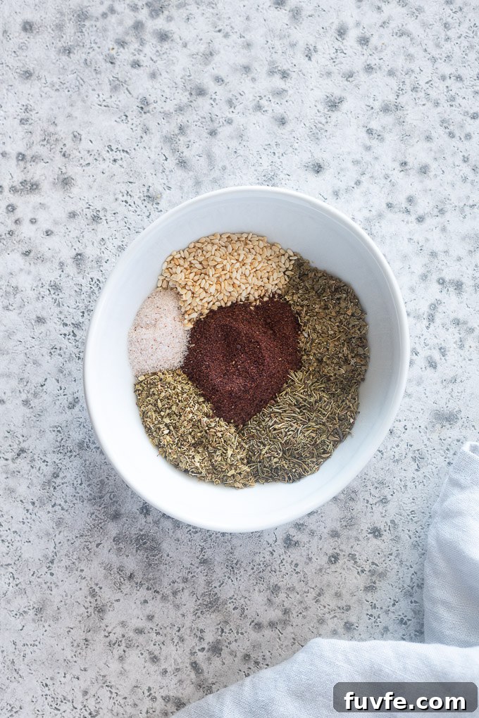 Za'atar seasoning ingredients separated in a bowl