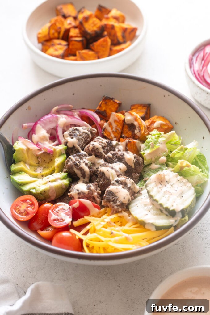 Easy burger bowls with burger sauce drizzled over the top.