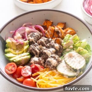 Easy burger bowls with burger sauce drizzled over the top.