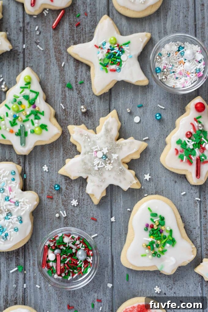 Soft cut out Christmas cookies with shiny sprinkles.