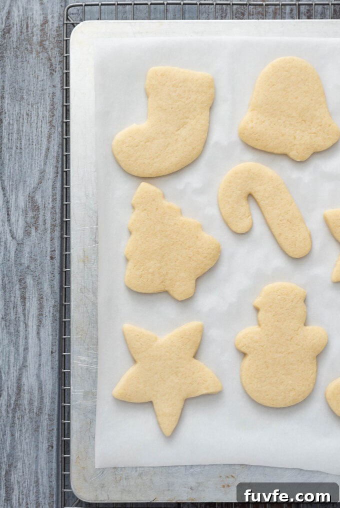 Soft cut out sugar cookies on baking sheet.